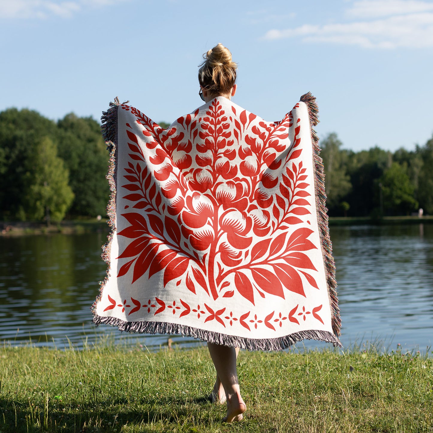 woman wearing a woven blanket with flower design