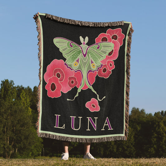 Woven blanket with a luna moth design