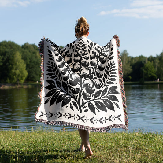 woman wearing a woven blanket with graphic design