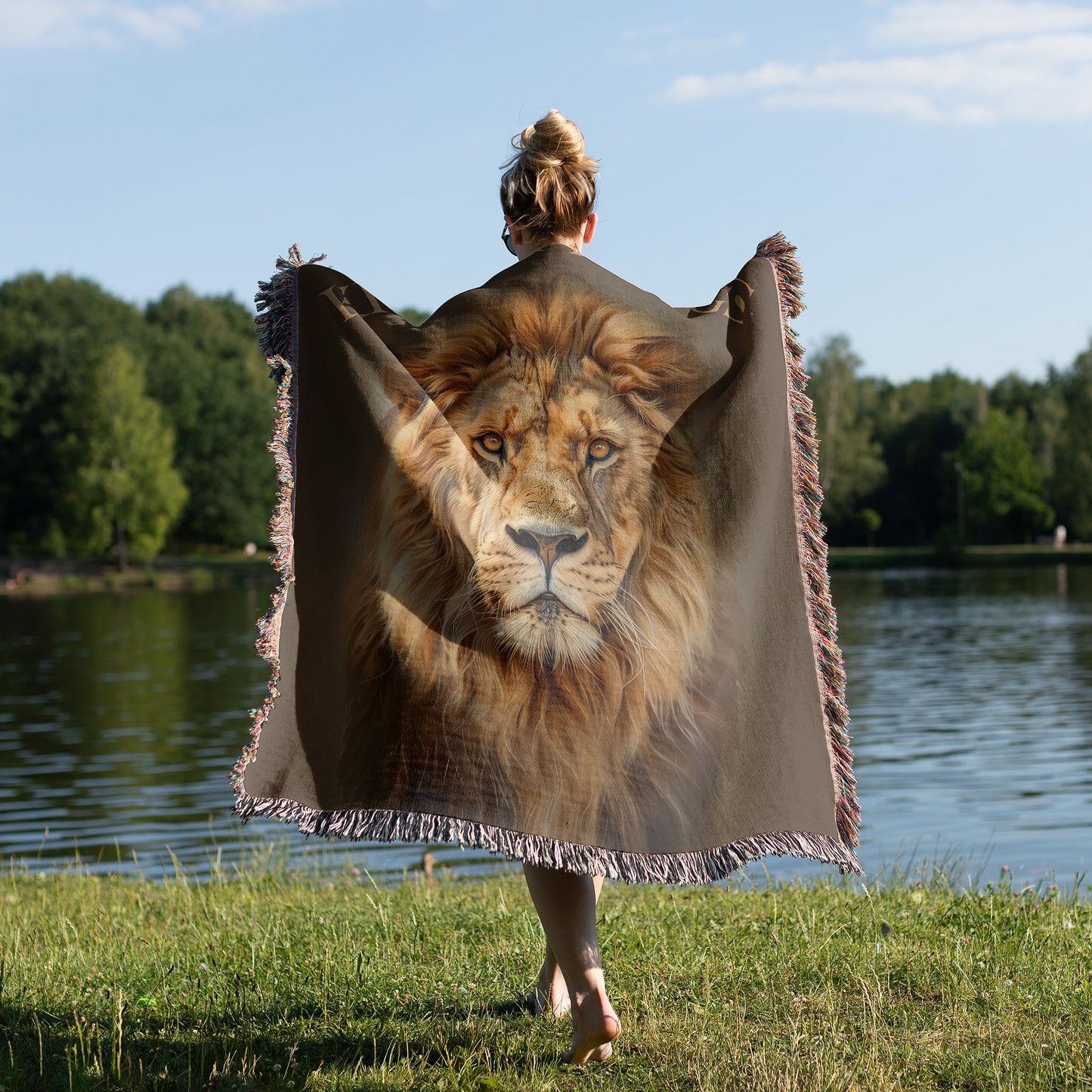 woman wearing a woven blanket with a lion design