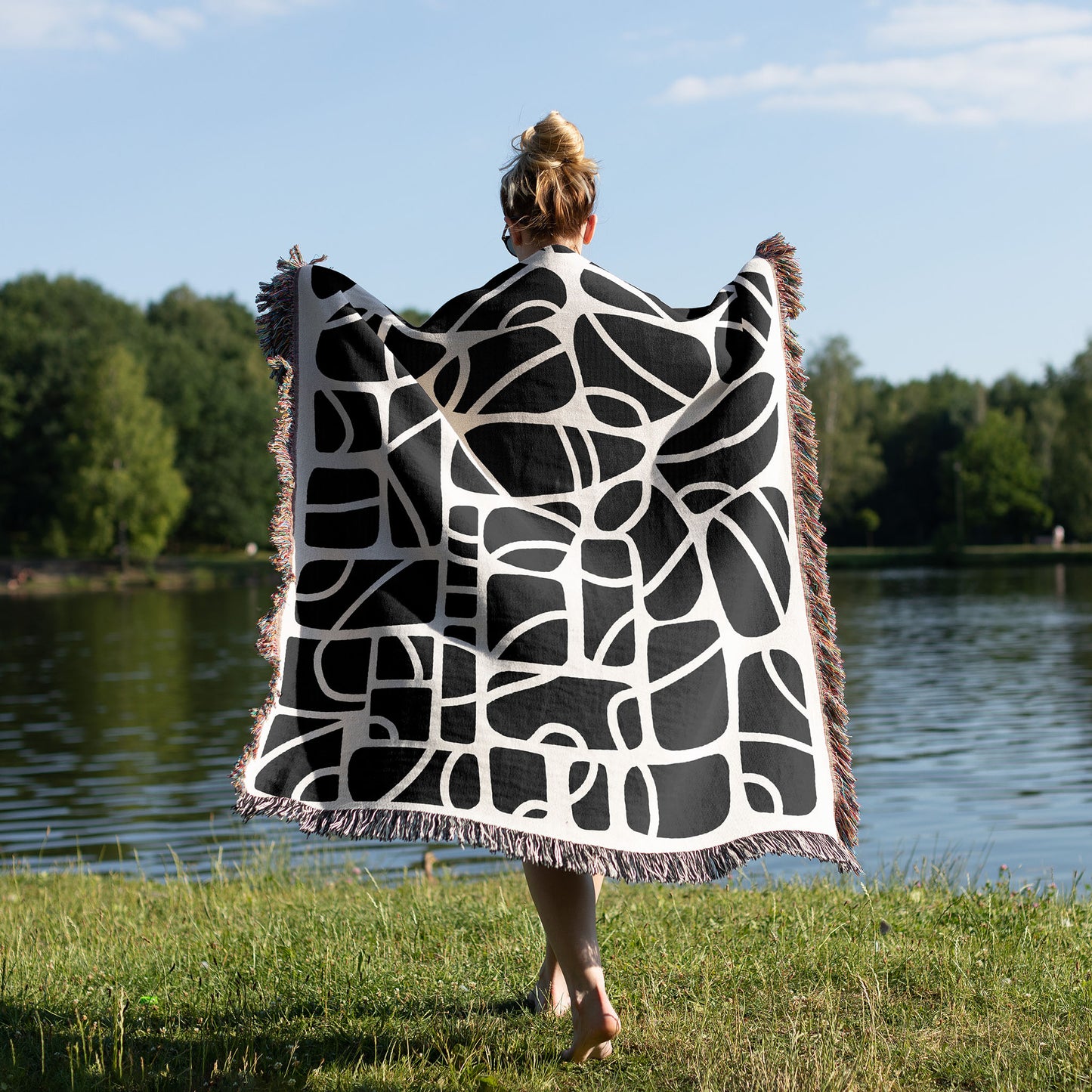 woman wearing a woven blanket