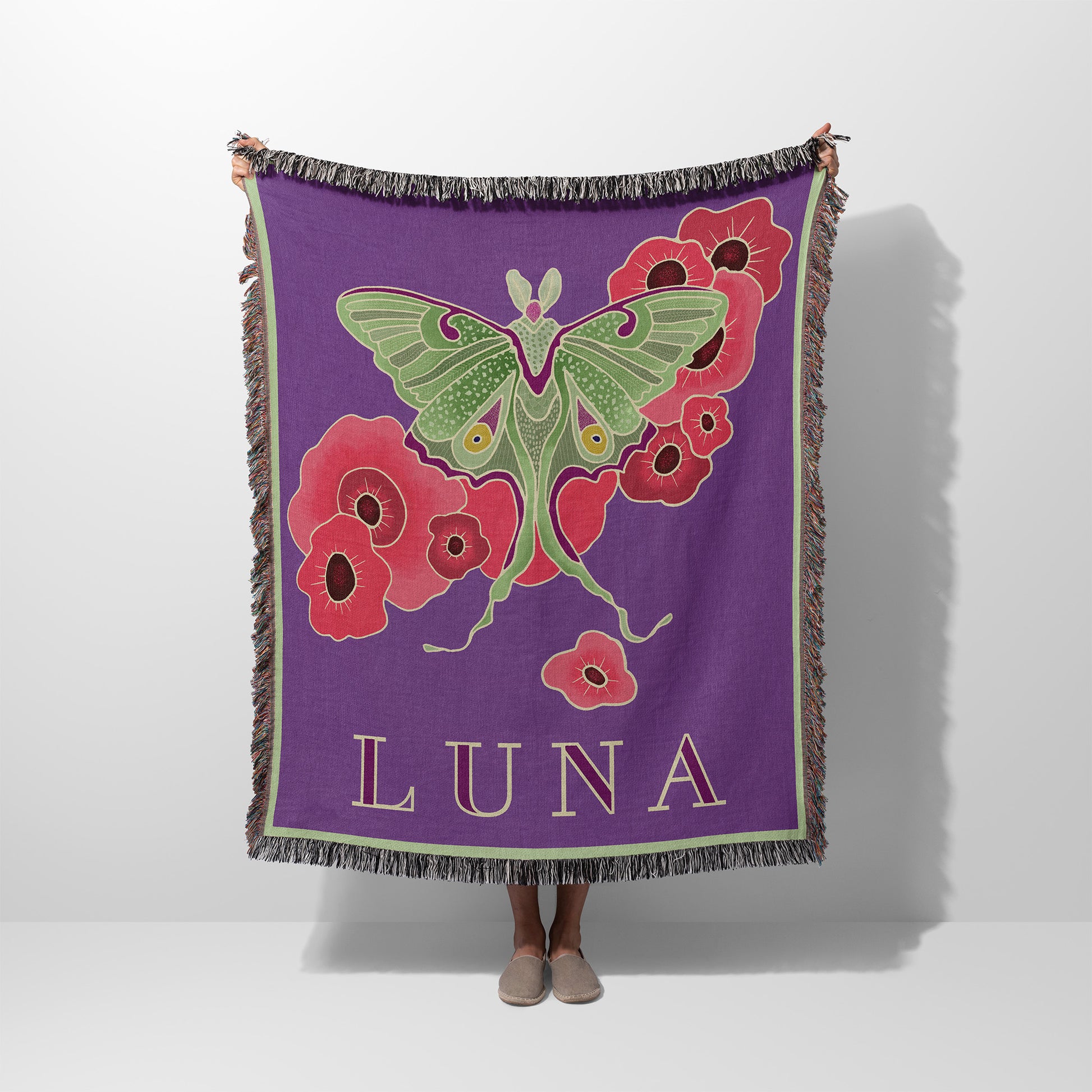 Woven blanket with a luna moth design